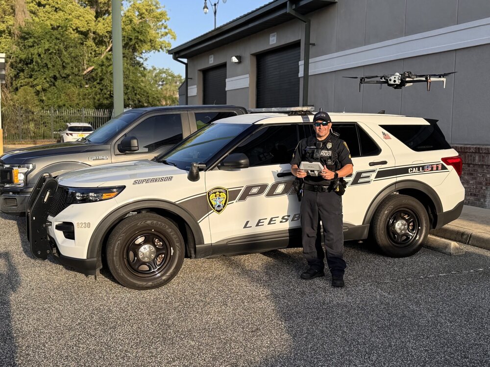 Could contain: land vehicle, vehicle, wheel, tire, outdoor, law enforcement, auto part, sport utility vehicle, transport, car, automotive exterior, bumper, automotive tire, compact sport utility vehicle, police car, fender, roof rack, crossover suv, rim, emergency service, police, person, officer