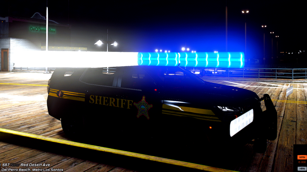 Could contain: vehicle, text, land vehicle, outdoor, car, screenshot, wheel, transport, track, ground, light, night