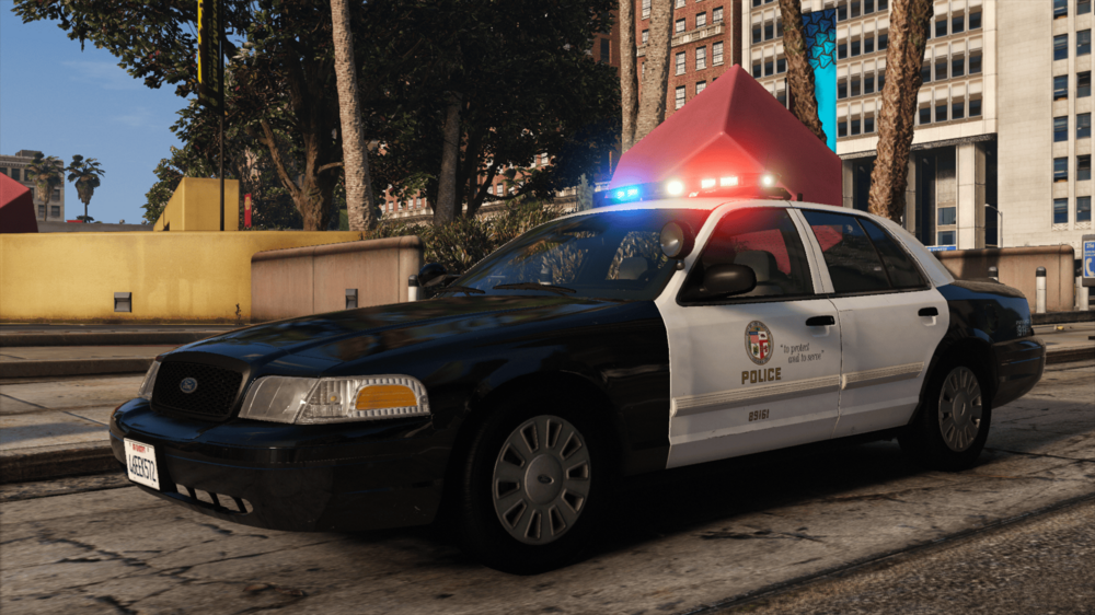 Could contain: vehicle, land vehicle, outdoor, wheel, transport, ford crown victoria police interceptor, full-size car, law enforcement, car, sedan, tire, police car, police, text, mid-size car, road, street, city