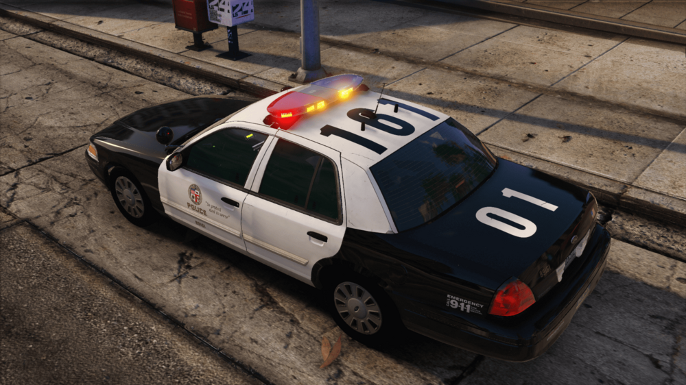 Could contain: vehicle, land vehicle, wheel, outdoor, police, tire, ground, transport, road, car, police car, street, auto part, sidewalk