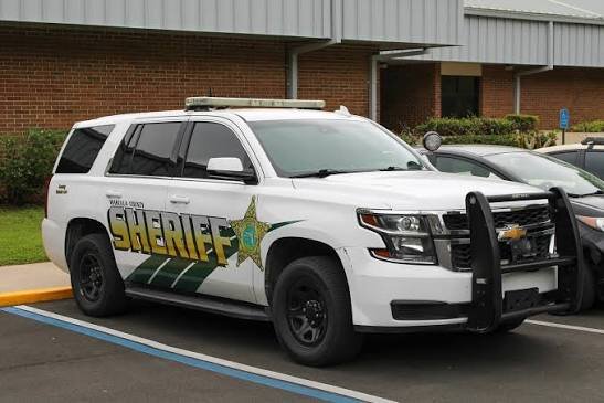 Could contain: vehicle, land vehicle, wheel, transport, tire, law enforcement, outdoor, police car, car, bumper, sport utility vehicle, police, text, ford, full-size car, auto part, compact sport utility vehicle, road, vehicle registration plate, automotive exterior, motor vehicle, roof rack, van