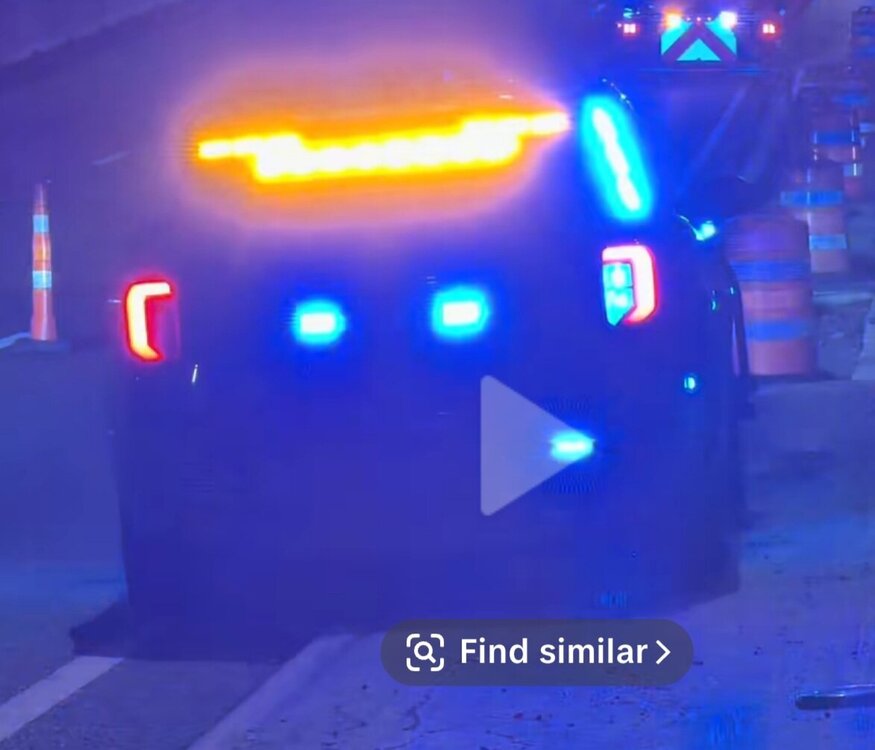 Could contain: text, screenshot, light, vehicle, land vehicle, neon, outdoor, street, night, car